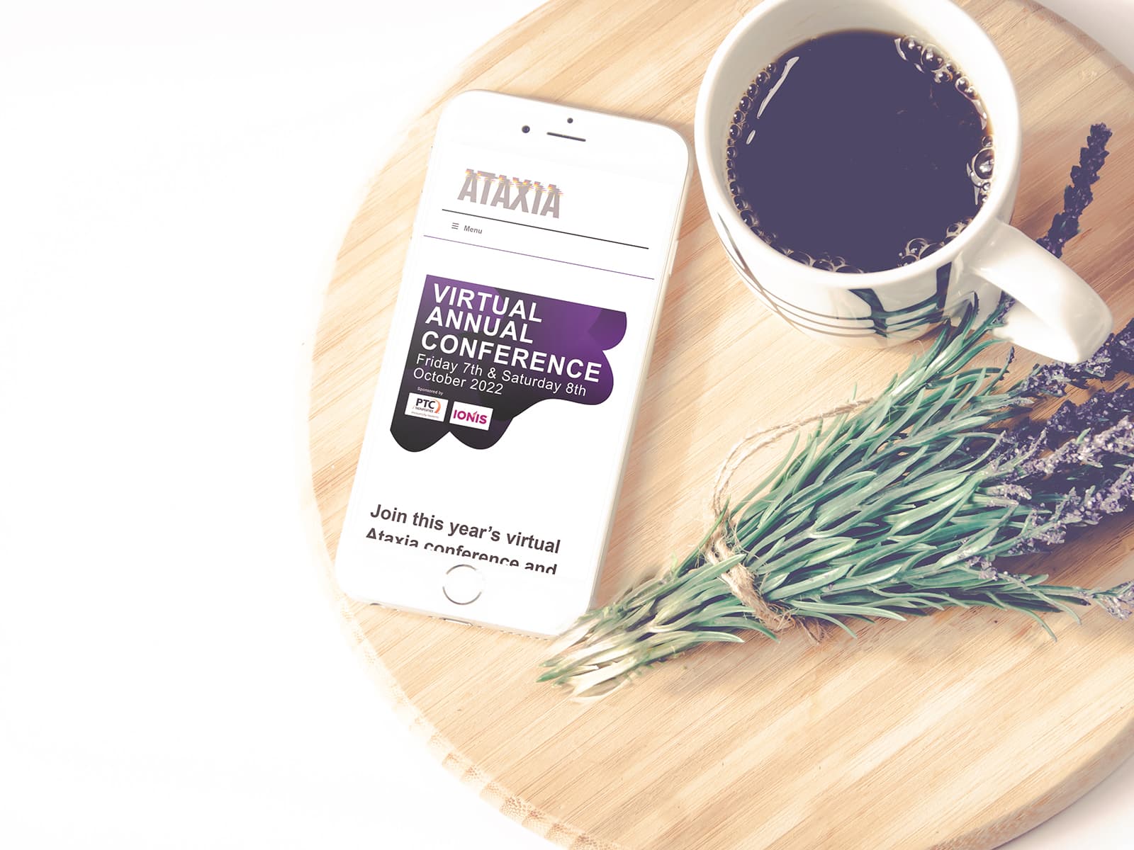 iPhone on table showing Ataxia website